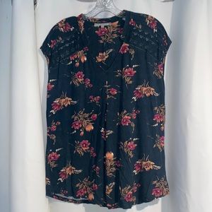Green casual top with rust and purple flowers